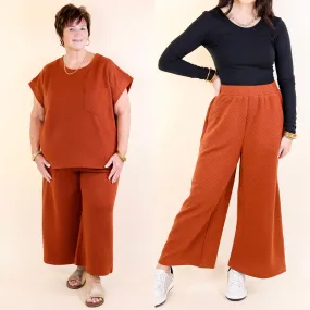 Glamour on the Go Textured Wide Leg Pant in Rust Orange